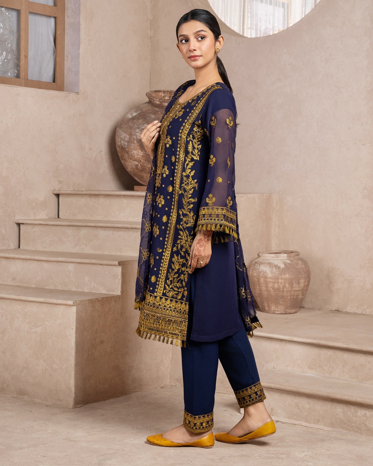 Elegant Pakistani formal outfit featuring a full embroidered chiffon shirt and dupatta with intricate zardozi work, paired with embroidered Malai fabric trousers. Available in small, medium, and large sizes from Riwaj Fashions.