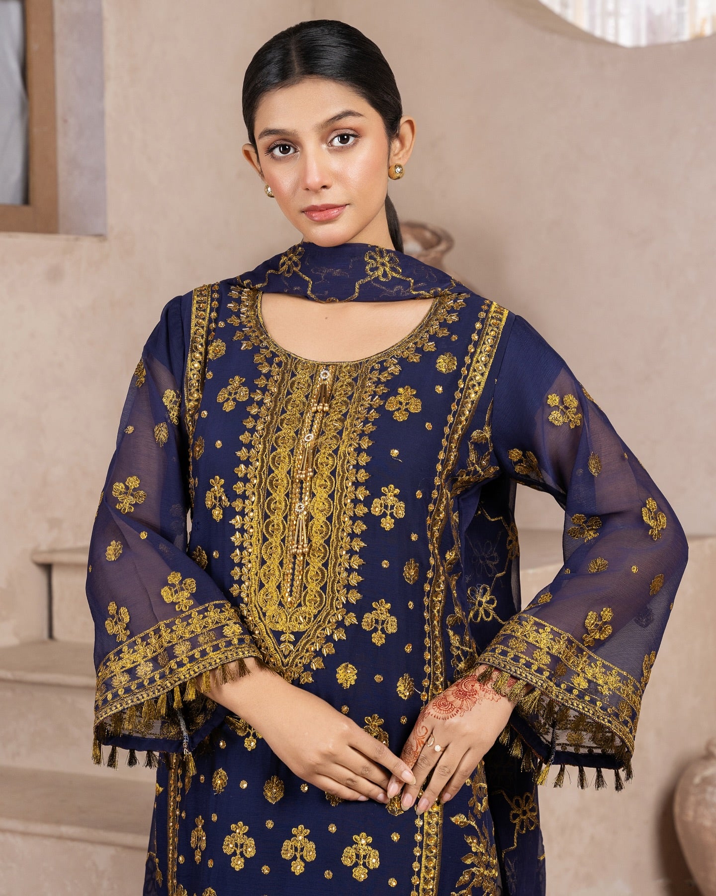 Elegant Pakistani formal outfit featuring a full embroidered chiffon shirt and dupatta with intricate zardozi work, paired with embroidered Malai fabric trousers. Available in small, medium, and large sizes from Riwaj Fashions.